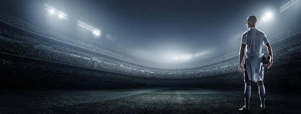 Soccer Uniform Poster featuring the photograph Soccer Player With Ball In Stadium by Dmytro Aksonov