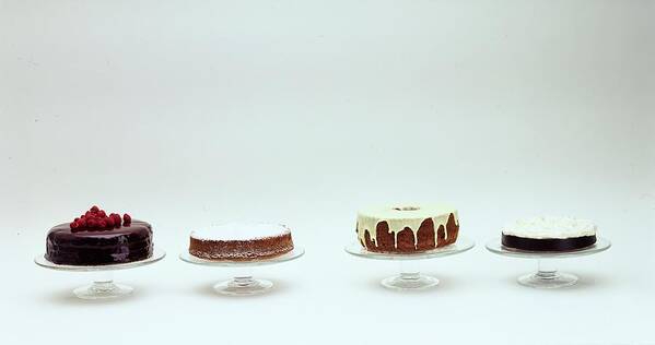 Food Poster featuring the photograph Four Cakes Side By Side by Romulo Yanes