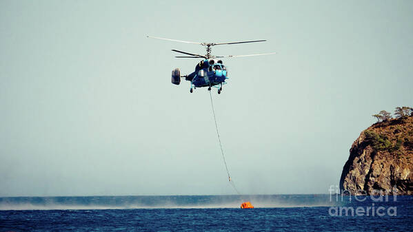 Aerospace Poster featuring the photograph Helicopter firefighter take water in the sea by Raimond Klavins