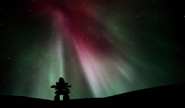 Inukchuk Poster featuring the digital art Northern lights above an inukchuk in Saskatchewan by Mark Duffy