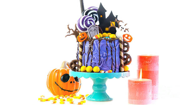 Halloween Poster featuring the photograph Halloween candyland novelty drip cake on white background. by Milleflore Images