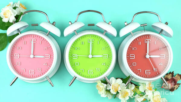 Alarm Poster featuring the photograph Springtime Daylight Saving Time Clocks #1 by Milleflore Images