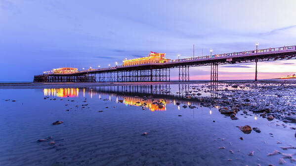 Beach Poster featuring the photograph Reflection of the pier at sunset by Andrew Lalchan