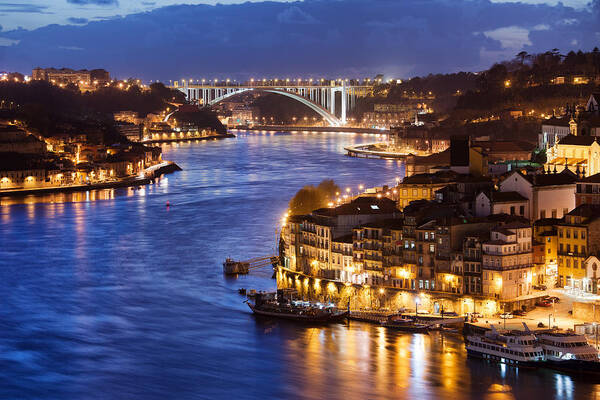 Porto Poster featuring the photograph City of Porto by Douro River at Night in Portugal #1 by Artur Bogacki