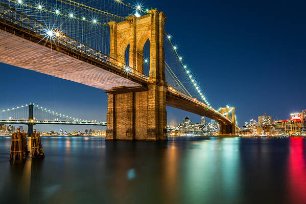 Architecture Poster featuring the photograph Illuminated Brooklyn Bridge by night #1 by Mihai Andritoiu