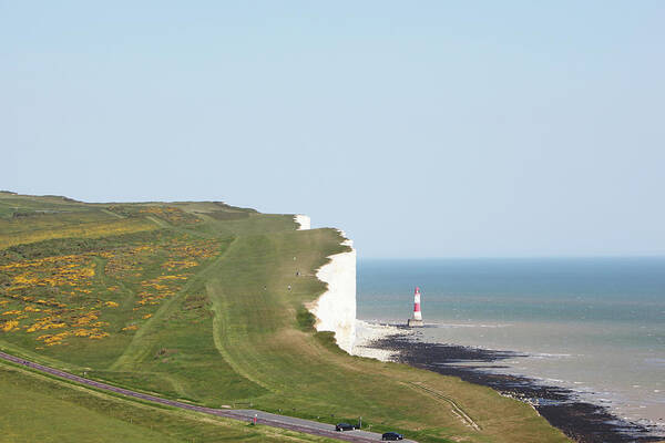 Tranquility Poster featuring the photograph People Walking On Beachy Head #1 by Richard Newstead