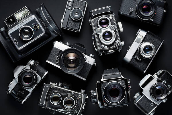 Black Background Poster featuring the photograph Vintage Cameras #1 by Jorg Greuel