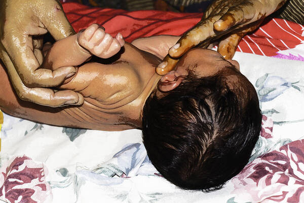 5 Day Old Baby Poster featuring the photograph 5 day old Indian baby getting a light massage using mustard oil by Ashish Agarwal