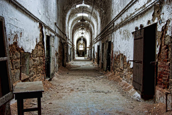 Eastern State Penitentiary Poster featuring the photograph Abandoned Cell Block 3 by Michael Dorn