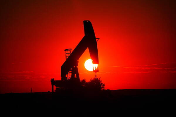 Sunset Poster featuring the photograph American Oil by Jeff Swan