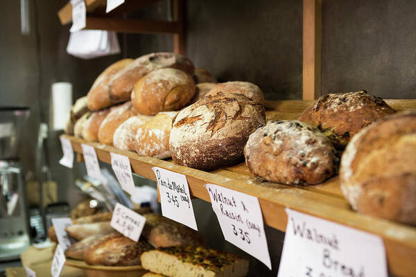 Bakery Poster featuring the photograph Artisan Bread On Shelves In Bakery by Betsie Van Der Meer