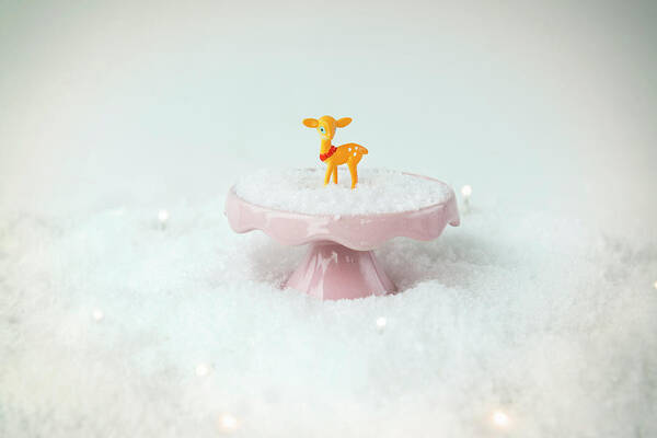 Fake Snow Poster featuring the photograph Baby Deer On A Snowy Landscape by Mieke Dalle