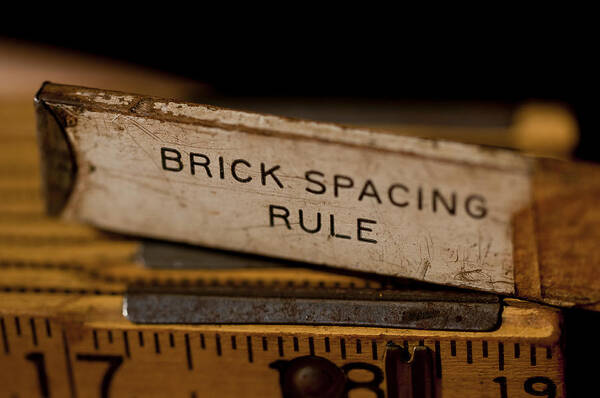 Rusty Poster featuring the photograph Brick Mason's Rule by Wilma Birdwell