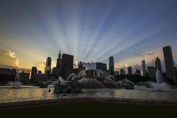 Chicago Skyline Poster featuring the photograph Buckingham Fountain with rays of sunlight by Sven Brogren