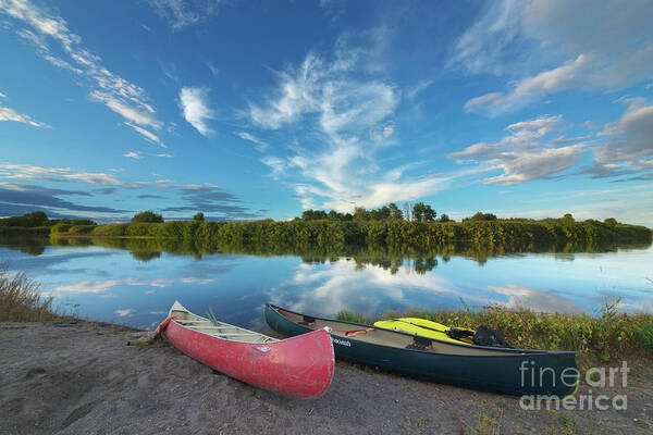 00559205 Poster featuring the photograph Canoes With Clouds Reflecting by Yva Momatiuk John Eastcott