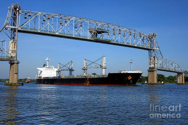 Freight Poster featuring the photograph Cargo Ship under Bridge by Olivier Le Queinec