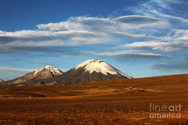 Chile Poster featuring the photograph Clouds over the Payachatas volcanos Chile by James Brunker