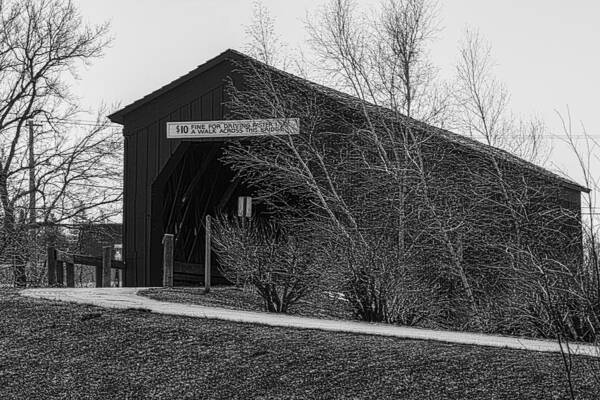 Covered Bridge Zumbrota Minnesota Zumbro River Wood Grass Road Black And White Grey Gray Tree Trees Water Sign Historic History Structure Engineer Engineered Enigineering Poster featuring the photograph Covered Bridge by Tom Gort