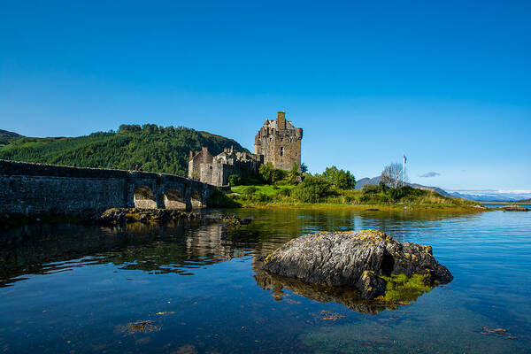 Scotland Poster featuring the photograph Eilean Donan Castle In Scotland by Andreas Berthold