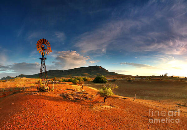 First Light Early Morning Windmill Dam Rawnsley Bluff Wilpena Pound Flinders Ranges South Australia Australian Landscape Landscapes Outback Red Earth Blue Sky Dry Arid Harsh Poster featuring the photograph First Light on Wilpena Pound by Bill Robinson