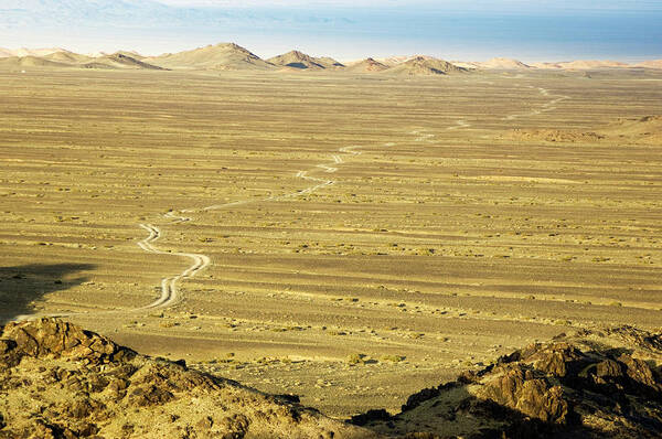 Desert Poster featuring the photograph Gobi Desertscape With Road by Ted Wood