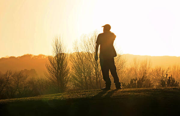 Golfer Poster featuring the photograph Golfer at sunset by Steve Ball