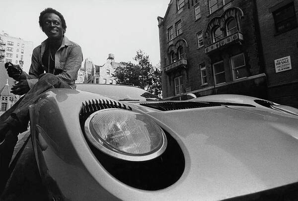 Music Poster featuring the photograph Jazz Musician Miles Davis Sitting On The Hood by Mark Patiky