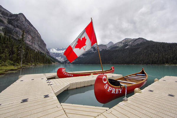 Lake Poster featuring the photograph Lake Louise Canoes and Flag by Jack Nevitt