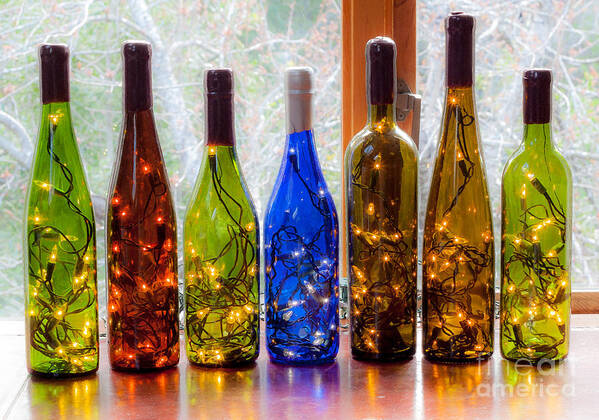 Wine Poster featuring the photograph Lighted Wine Bottles by Margaret Hood