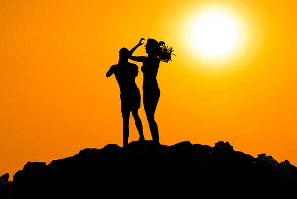 Man Poster featuring the photograph Man and woman silhouette at sunset by Brch Photography