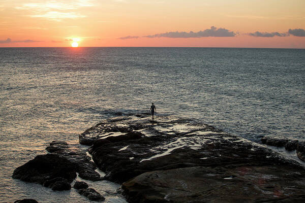 Tranquility Poster featuring the photograph Man On Rock By Sea At Sunset by James Morgan