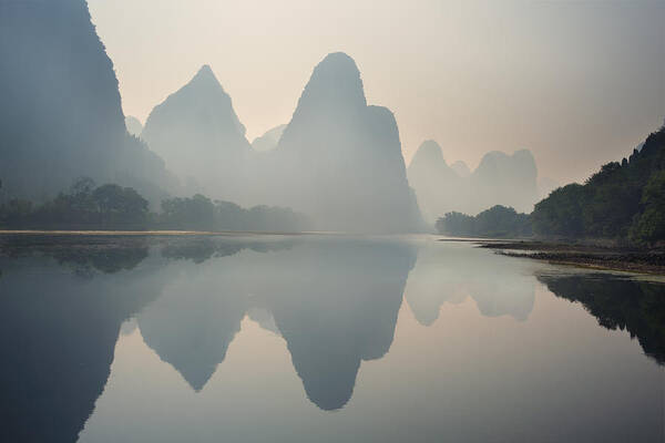Guangxi Poster featuring the photograph Misty sunrise 1 by Afrison Ma