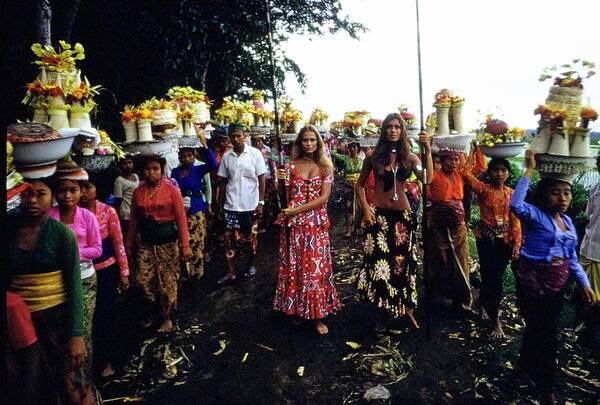 Fashion Poster featuring the photograph Models During Procession In Bali by Arnaud de Rosnay