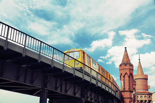 Berlin Poster featuring the photograph Moving Yellow Train In Kreuzberg U-bahn by Danilovi