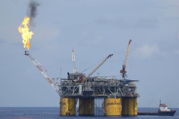 Oil Rig Poster featuring the photograph Production platform with flare by Bradford Martin