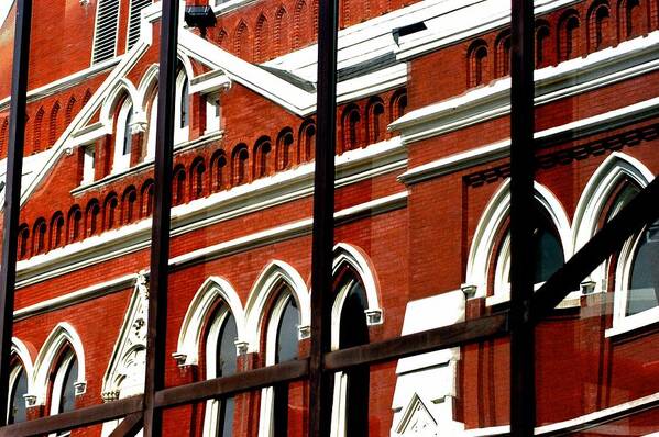 Red Brick Poster featuring the photograph Refleced Ryman by Joseph Yarbrough