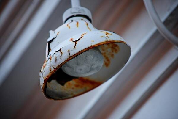 Rust Poster featuring the photograph Rusted light by Prince Andre Faubert