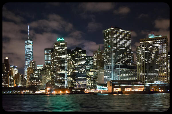 View Of South Ferry Manhattan New York City At Night From The Water Poster featuring the photograph South Ferry Manhattan at Night by Kenneth Cole