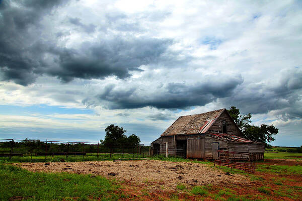 Barn Poster featuring the photograph Storms loom over Barn on the Prairie by Toni Hopper