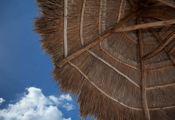 Beach Poster featuring the photograph Thatched Umbrella by Kyle Lee