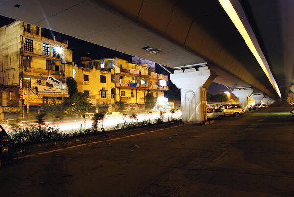 Cars Poster featuring the photograph Traffic Running Beneath Flyover by Sumit Mehndiratta