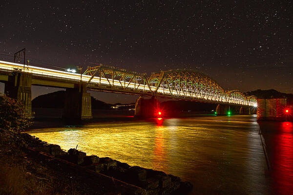 Hawkesbury River Railway Bridge Poster featuring the photograph Train lights in the night by Miroslava Jurcik