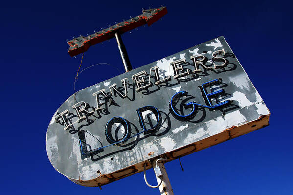 Neon Sign Poster featuring the photograph Travelers Lodge Neon by Daniel Woodrum