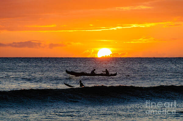 Hawaii Poster featuring the photograph Two men paddling a Hawaiian outrigger canoe at sunset on Maui by Don Landwehrle