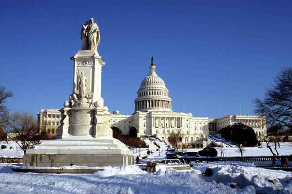 Statue Poster featuring the photograph Us Capitol Building In Winter Snow by Hisham Ibrahim