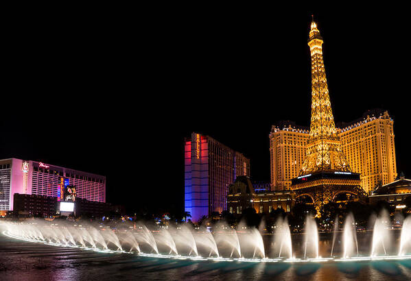 Vibrant Las Vegas Poster featuring the photograph Vibrant Las Vegas - Bellagio's Fountains Paris Bally's and Flamingo by Georgia Mizuleva