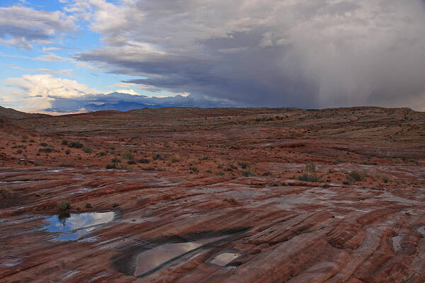 Nature Poster featuring the photograph Waterpockets And Storm At The Valley Of Fire by Steve Wolfe