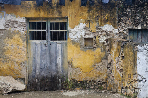 Maya Poster featuring the photograph Weathered Building And Door by Ellen Thane