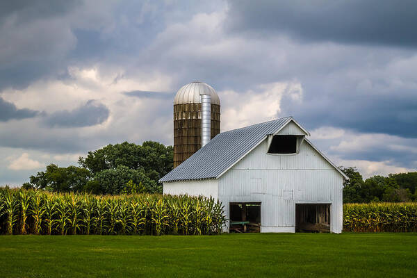 Art Poster featuring the photograph White Barn and Silo with Storm Clouds by Ron Pate