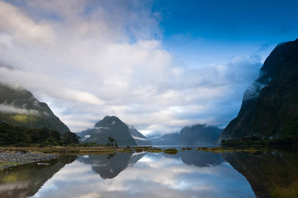 Background Poster featuring the photograph Cloudy morning at milford sound at sunrise #1 by U Schade
